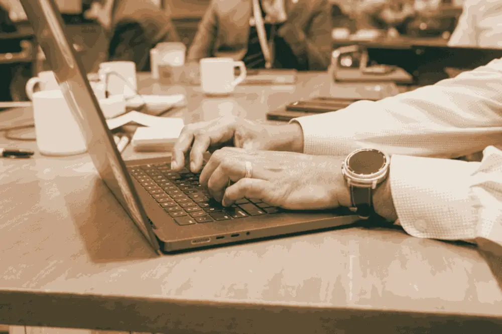 Hands on a laptop during the build